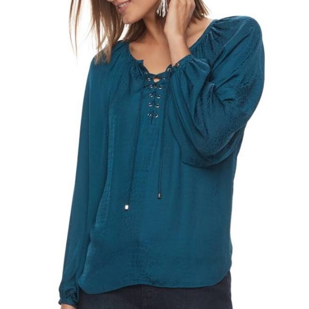 Jennifer Lopez blue lace up blouse